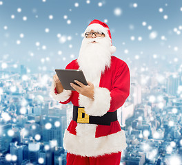 Image showing man in costume of santa claus with tablet pc