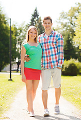 Image showing smiling couple walking in park