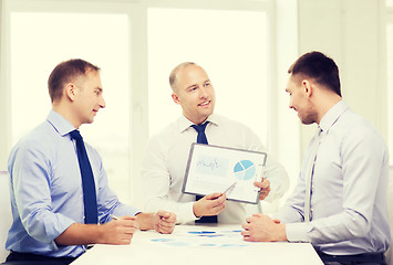 Image showing smiling businessmen with papers in office