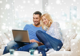 Image showing smiling happy couple with laptop at home