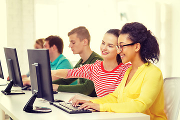 Image showing smiling students in computer class at school