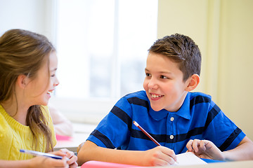 Image showing group of school kids writing test in classroom