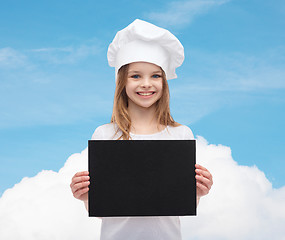 Image showing little cook or baker with blank black paper