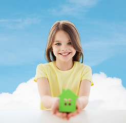 Image showing beautiful little girl holding paper house cutout