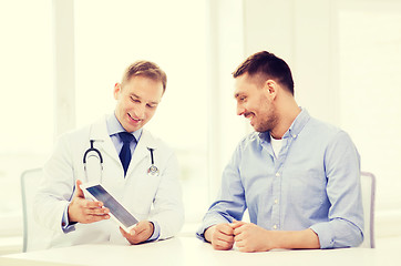 Image showing doctor with tablet pc and patient in hospital