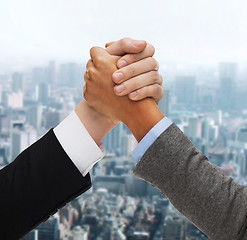 Image showing hands of two people armwrestling