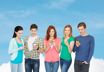 Image showing smiling students with smartphones