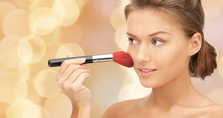 Image showing beautiful smiling woman with make up brush