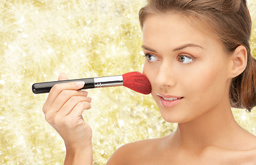 Image showing beautiful smiling woman with make up brush