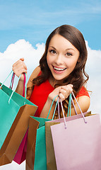 Image showing smiling woman with colorful shopping bags