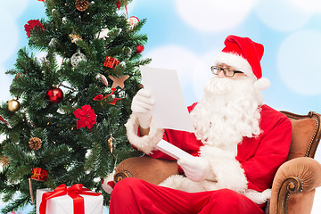 Image showing man in costume of santa claus with letter