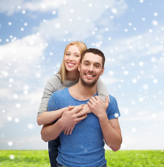 Image showing happy couple hugging outdoors