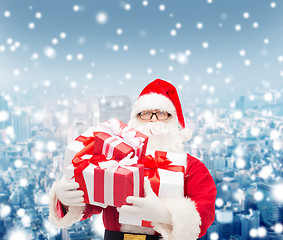 Image showing man in costume of santa claus with gift boxes