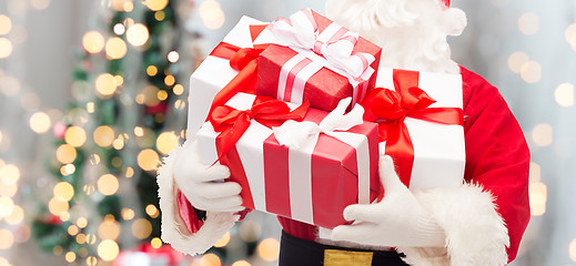 Image showing man in costume of santa claus with gift box