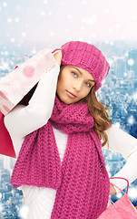 Image showing smiling young woman with shopping bags