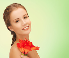 Image showing beautiful smiling young woman with flowers