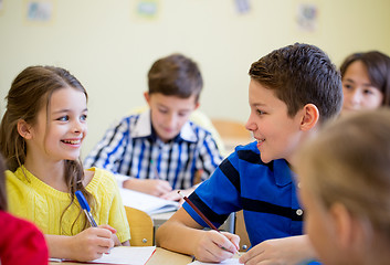 Image showing group of school kids writing test in classroom