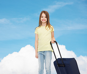 Image showing smiling little girl with suitcase