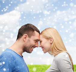 Image showing smiling couple looking at each other