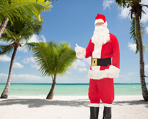 Image showing man in costume of santa claus showing thumbs up