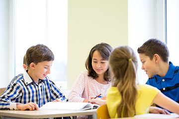 Image showing group of school kids writing test in classroom