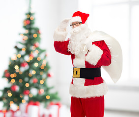 Image showing man in costume of santa claus with bag