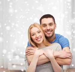 Image showing happy couple hugging at home