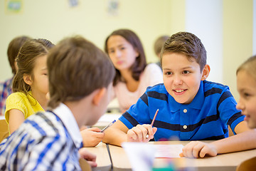 Image showing group of school kids writing test in classroom