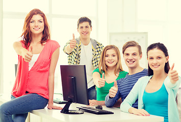 Image showing group of smiling students showing thumbs up