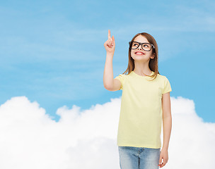 Image showing smiling cute little girl in black eyeglasses