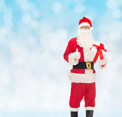 Image showing man in costume of santa claus with gift box