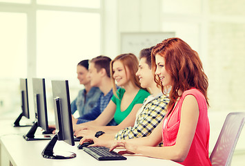 Image showing female student with classmates in computer class
