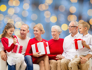 Image showing smiling family with gifts