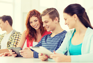 Image showing smiling students with tablet pc at school