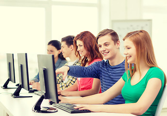 Image showing female student with classmates in computer class