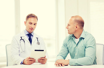 Image showing doctor with tablet pc and patient in hospital