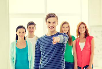 Image showing students with teenager in front pointing at you