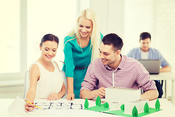 Image showing smiling architects working in office