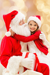 Image showing smiling little girl with santa claus