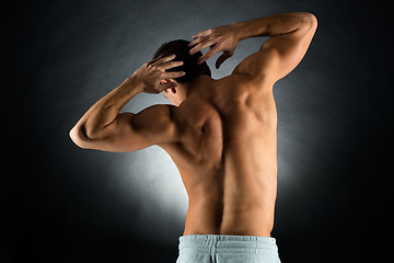 Image showing young male bodybuilder from back
