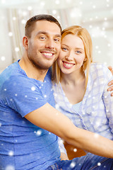 Image showing happy couple hugging at home