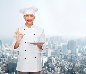 Image showing smiling female chef with tablet pc computer