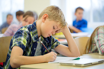 Image showing group of school kids writing test in classroom