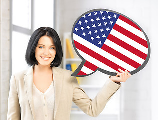 Image showing smiling woman with text bubble of american flag