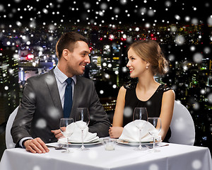 Image showing smiling couple at restaurant