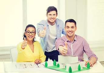 Image showing smiling architects working in office