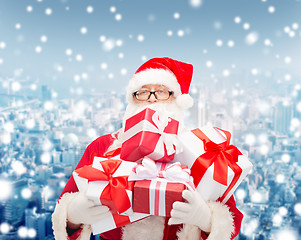 Image showing man in costume of santa claus with gift boxes