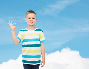 Image showing little boy in casual clothes making ok gesture