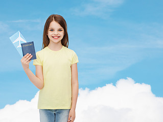 Image showing smiling little girl with ticket and passport