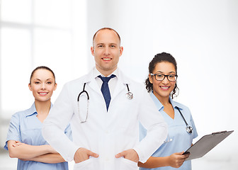 Image showing group of smiling doctors with clipboard